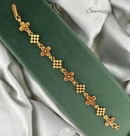 ALTERNATING CROSS AND FLORAL MOTIF BRACELET