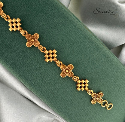 ALTERNATING CROSS AND FLORAL MOTIF BRACELET